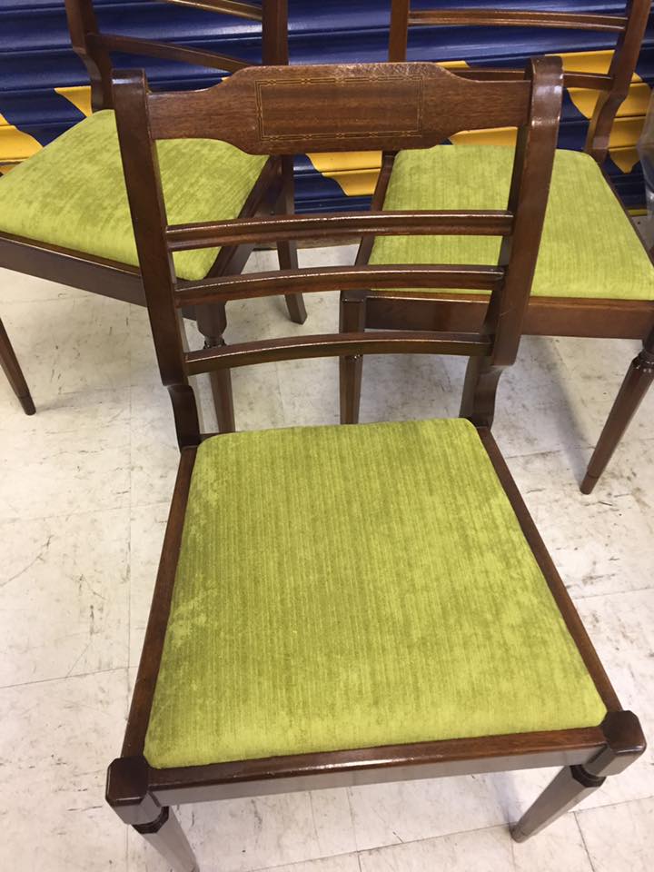 Wooden dining chair with green textile