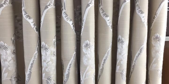 Cream curtains with plant patterns
